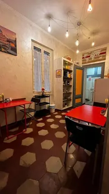 a room with a ping pong table and a red table at Da Vinci in Rome