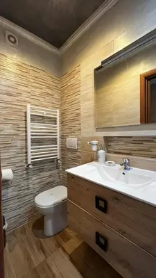 a bathroom with a white toilet and a sink at Da Vinci in Rome