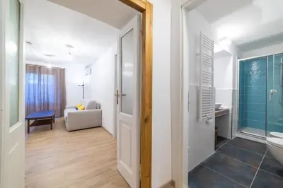 a bathroom with a toilet and a sink at Domus Domi Barberini Sq. in Rome