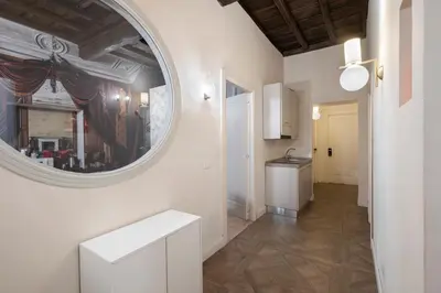 a bedroom with a sink and a mirror at 19 Steps Trevi in Rome