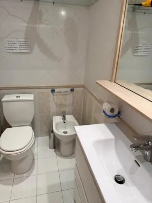 a small bathroom with a toilet and a sink at Glamour Center Of Rome in Rome