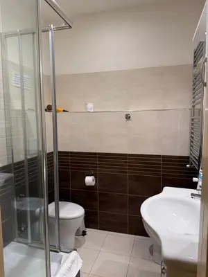 a bathroom with a toilet and a sink at Glamour Center Of Rome in Rome