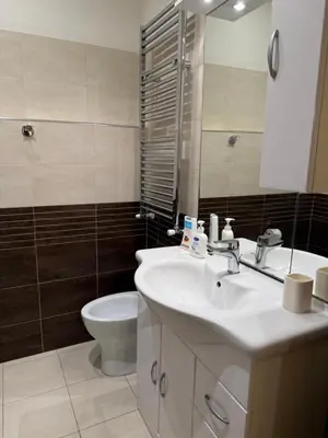 a bathroom with a sink and a toilet and a mirror at Glamour Center Of Rome in Rome