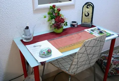 a table with a chair with a cake on it at Colombo Holidays APT in Rome