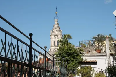 a steeple of a building with a tower in the background at Di Rienzo Pantheon Palace in Rome