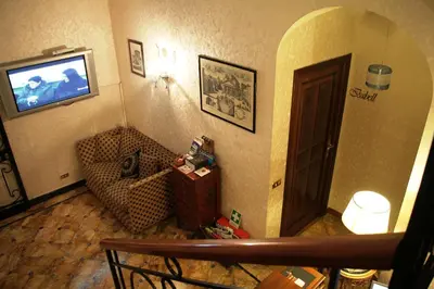 a living room with a television on a wall at Di Rienzo Pantheon Palace in Rome