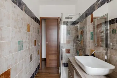 a bathroom with a sink and a mirror at Scarfoglio Apartment, 4 persone, 2 camere, balcone, Wi-Fi, Stazione Tiburtina in Rome