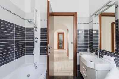 a bathroom with a tub and a sink at Casa Flo in Rome