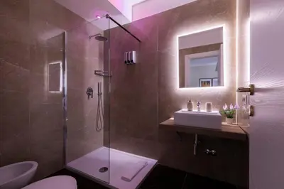 a bathroom with a shower and a sink and a toilet at Momo Central Rome 2 in Rome