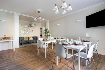 a dining room and living room with a table and chairs at Momo Central Rome 2 in Rome