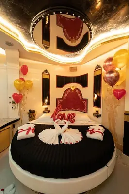 a bedroom with a large bed with balloons on it at Erossuite GuestHouse in Rome