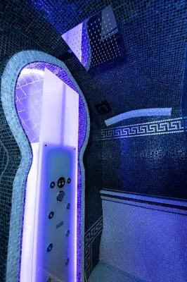 a video game remote control sitting in a mirror at Erossuite GuestHouse in Rome