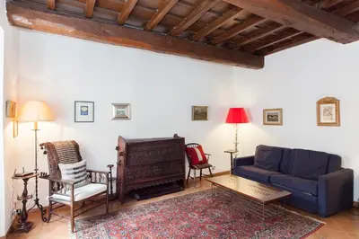a living room with a couch and a chair at Libri Flat in Rome