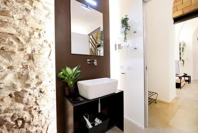 a bathroom with a sink and a mirror at Sky Dream Loft Trastevere in Rome