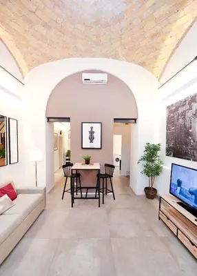 a living room with a couch and a table at Sky Dream Loft Trastevere in Rome