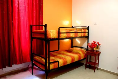 a bedroom with red walls and a bunk bed at Legend R.G. in Rome