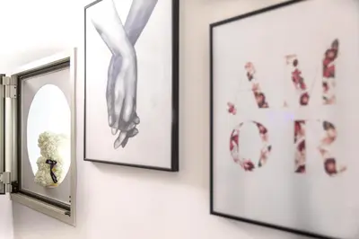 a mirror next to two pictures on a wall at Campo dè Fiori Detached Apartment Eligio - Top Collection in Rome