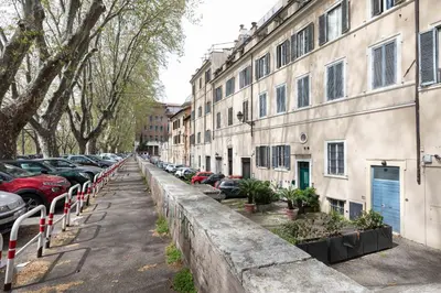 a street with cars parked next to buildings at Campo dè Fiori Detached Apartment Eligio - Top Collection in Rome