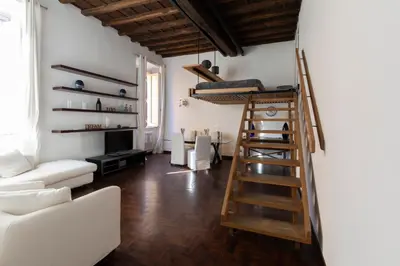 a living room with a loft bed and a couch at Rufina Apartment in Rome
