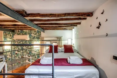 a bedroom with a bed in a room at San Calisto Suite in Rome