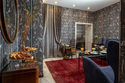 a living room with a table with a tray of food at The Inn at the Spanish Steps Luxury Collection - Mario De' Fiori Suite in Rome