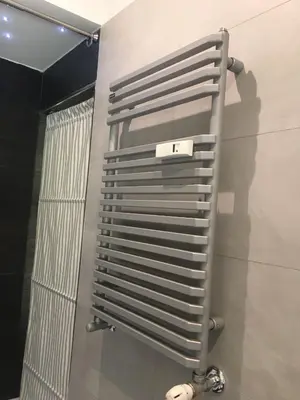 a metal towel rack on the wall of a bathroom at B&B Affaccio sul Vaticano in Rome
