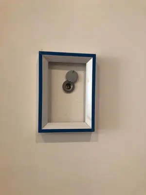 a blue picture of a clock on a wall at B&B Affaccio sul Vaticano in Rome