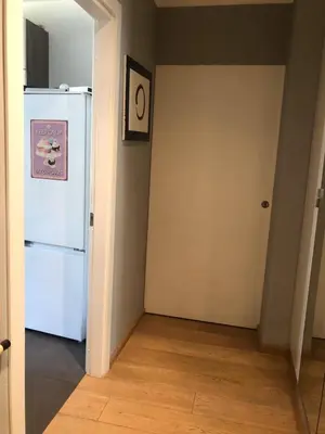 a kitchen with a white refrigerator in a room at B&B Affaccio sul Vaticano in Rome