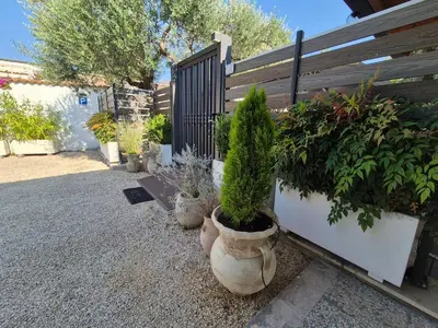 a row of potted plants in front of a fence at Lilli Home - Urban Garden in Rome