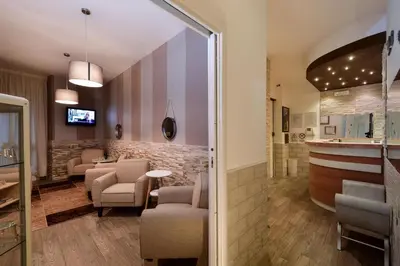 a waiting room with chairs and a bar at Rome Vatican Inn in Rome