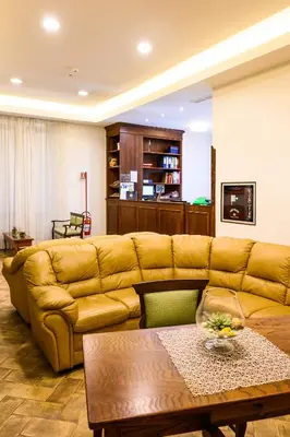 a living room with a couch and a coffee table at Casa I Cappuccini in Rome