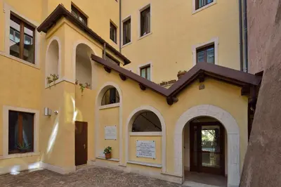 a yellow building with an entrance to a building at Casa I Cappuccini in Rome