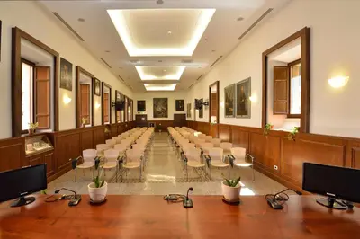 a conference room with a row of tables and chairs at Casa I Cappuccini in Rome