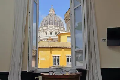 a view from a window of a building with a dome at Michelangelo Charmsuite in Rome