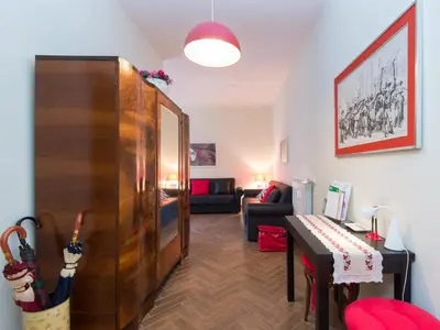 a living room with a table and a piano at Apartment Regina's House - St Peter by Interhome in Rome
