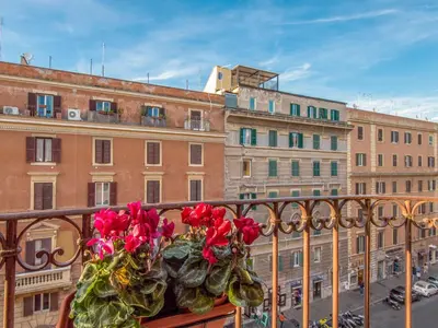 a bunch of roses sitting on a balcony at Apartment Regina's House - St Peter by Interhome in Rome