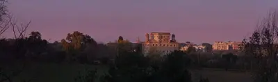 a group of buildings in a city at dusk at Il Baffetto B&B in Rome