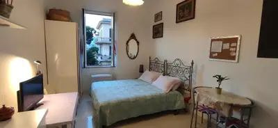 a bathroom with a shower and a toilet and a sink at Aquila 52 in Rome