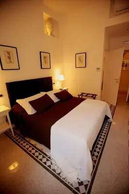 a bedroom with a large bed in a room at Residenza Mazzini in Rome