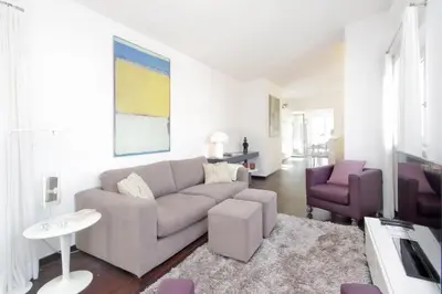 a living room with a couch and a chair at Crispi Luxury Apartments - My Extra Home in Rome