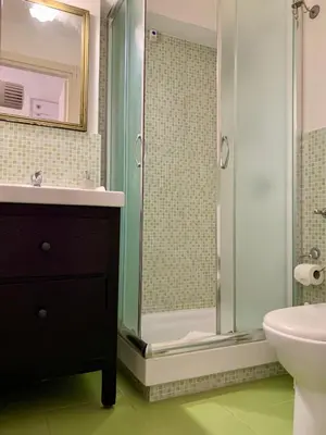 a bathroom with a shower and a sink and a toilet at Guest House Casa Vicenza in Rome