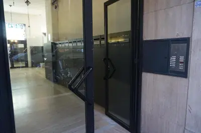 a door in a building with a glass window at Hotel Max in Rome