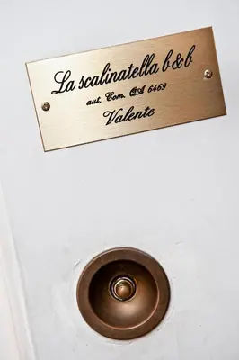 a sign that reads in scottishalam elf and can be seen on at B&B La Scalinatella in Rome