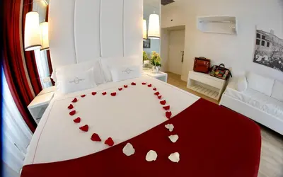 a heart shaped bed in a hotel room at Tullia&Prisca Relais in Rome