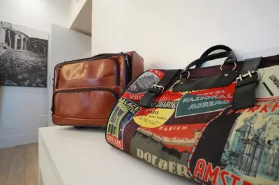 a pile of luggage sitting on top of a wall at Tullia&Prisca Relais in Rome
