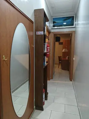 a mirror on a wall next to a hallway at Domus Roxy in Rome