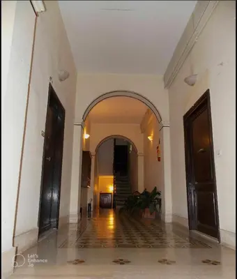 an empty hallway with an archway in a building at Domus Roxy in Rome