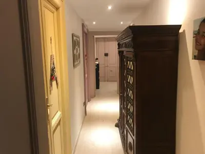 a hallway with a hallway leading to a room at Aquarius Inn in Rome