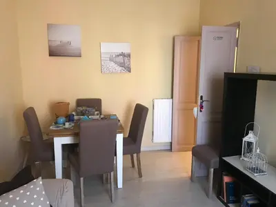 a dining room with a table and chairs at Aquarius Inn in Rome