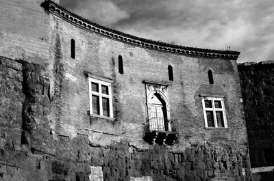 a black and white photo of a building with windows at Aquarius Inn in Rome